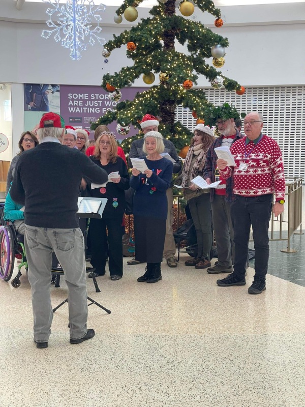 Christmas carol singing collecting for Cruse charity at Serpentine Green December 2023.